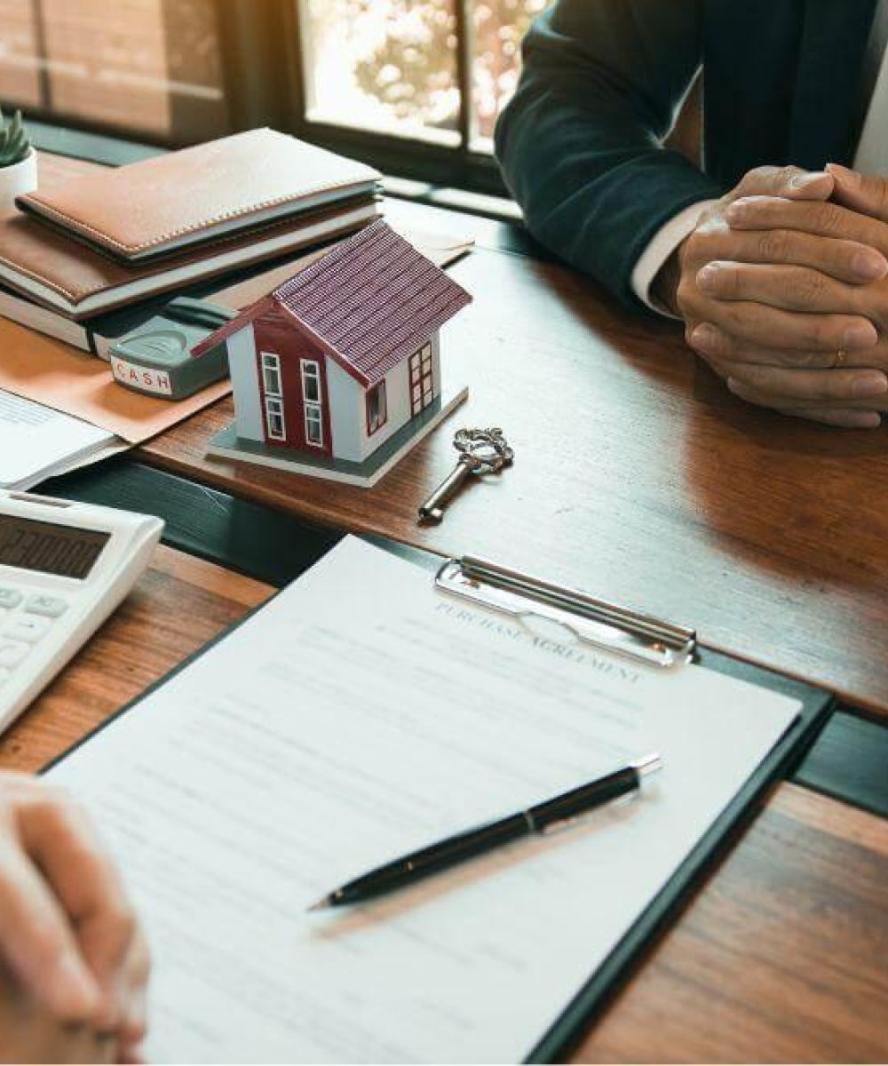 Couple reviewing commercial lease finances with a calculator