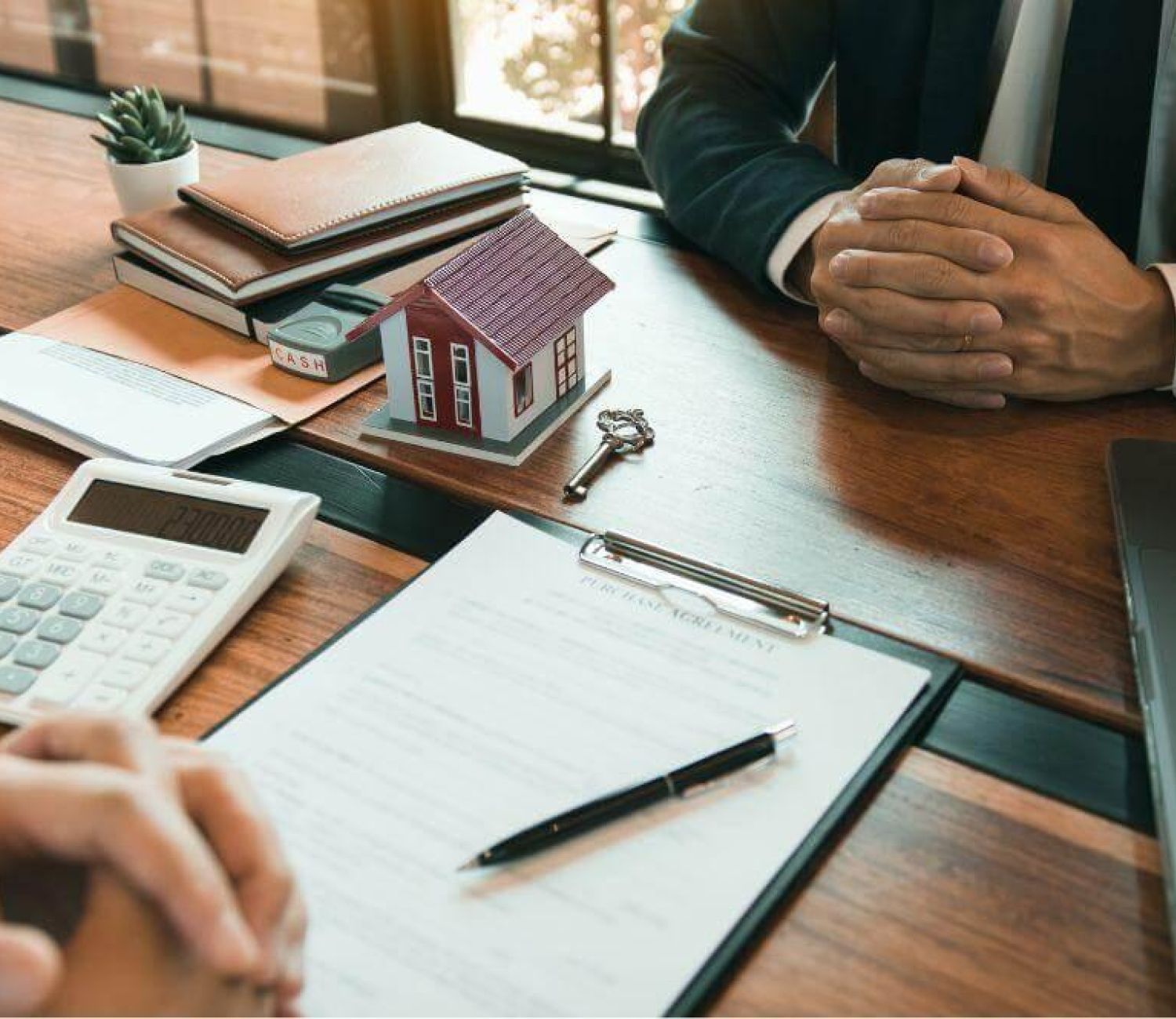 Couple reviewing commercial lease finances with a calculator