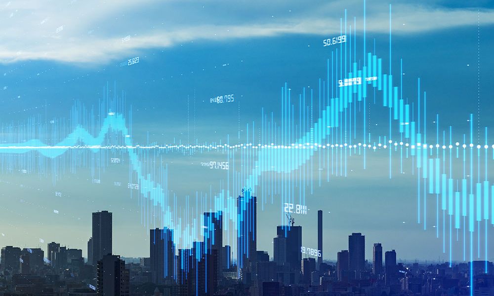 City skyline with digital financial graph overlay, illustrating data trends and urban economic growth.