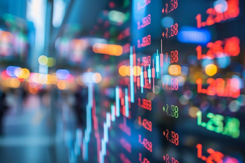 Colorful stock market graph and numbers on digital screen, illustrating financial data and trading activity.