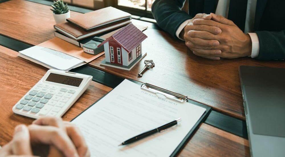 Couple reviewing commercial lease finances with a calculator