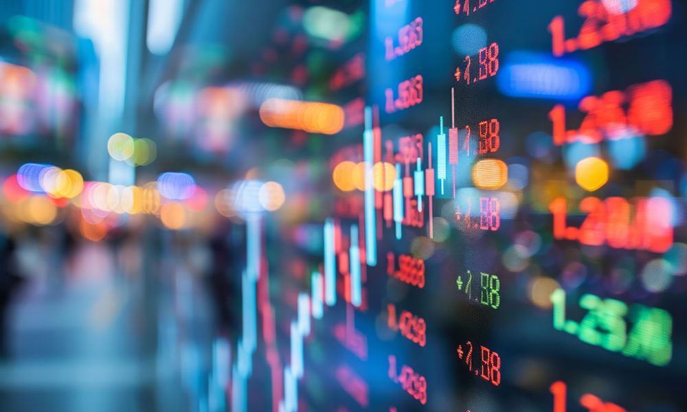 Colorful stock market graph and numbers on digital screen, illustrating financial data and trading activity.
