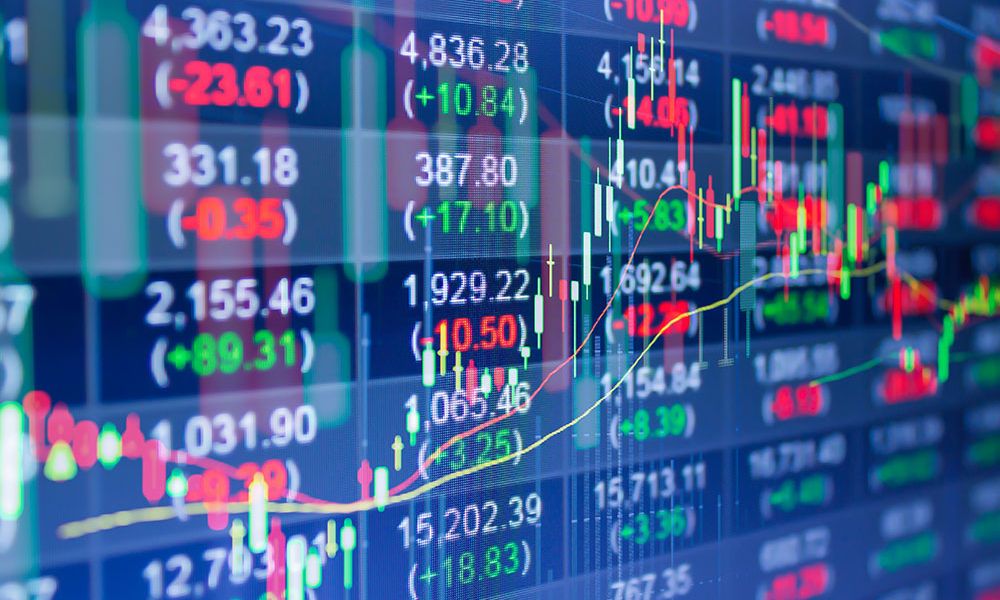 Stock market chart with fluctuating numbers and graphs on a digital screen indicating financial trading dynamics.